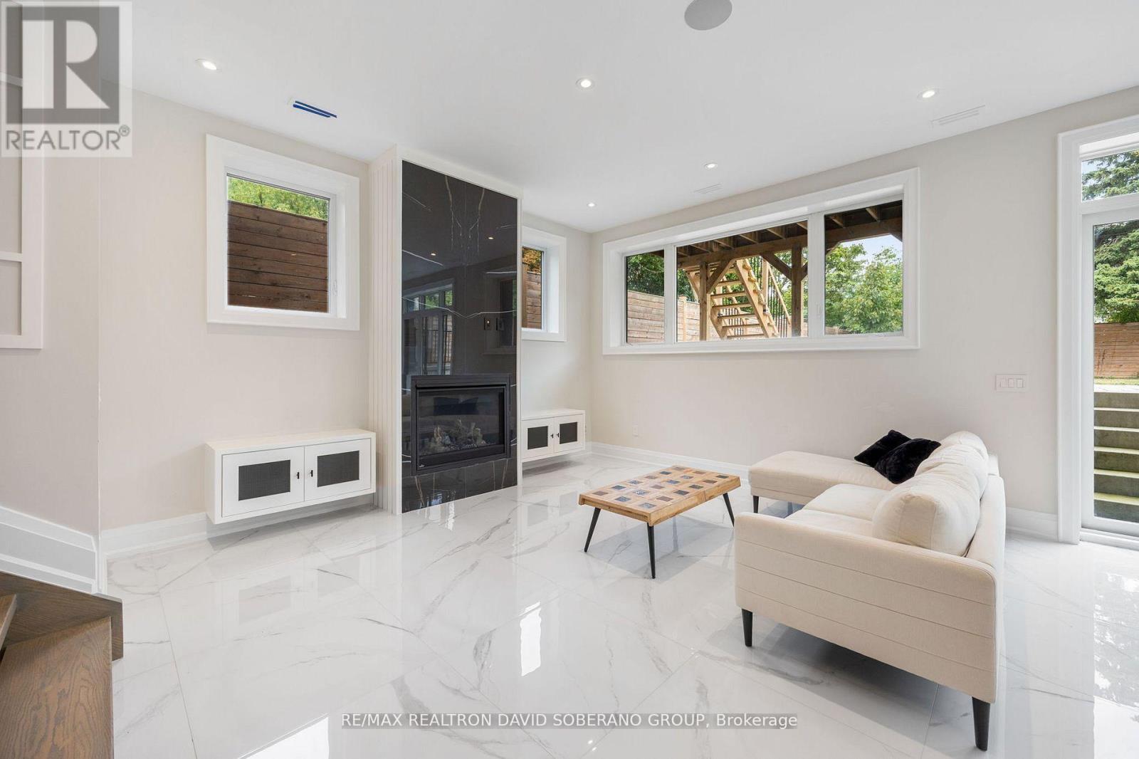 106 Allingham Gardens, Toronto, ON - Indoor Photo Showing Other Room With Fireplace
