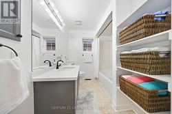 Quartz Counter, Black Faucets, Ceramic Tile -