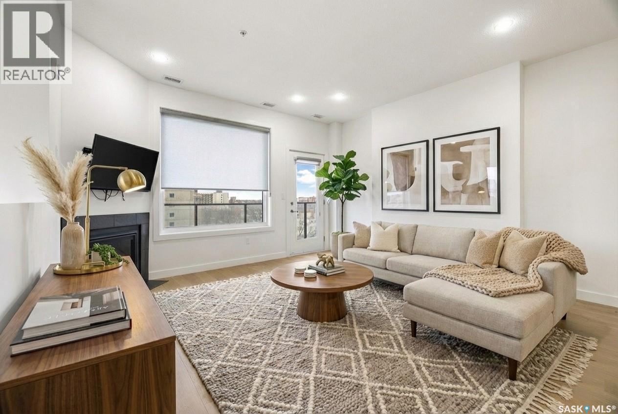 607 2055 Rose Street, Regina, SK - Indoor Photo Showing Living Room With Fireplace