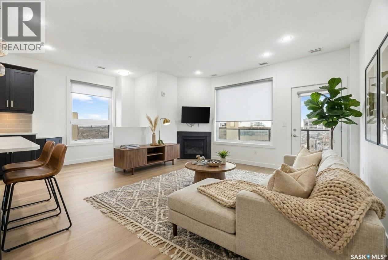 607 2055 Rose Street, Regina, SK - Indoor Photo Showing Living Room With Fireplace