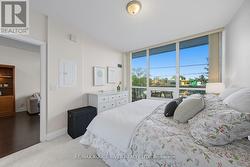 Primary Bedroom - floor to ceiing windows -