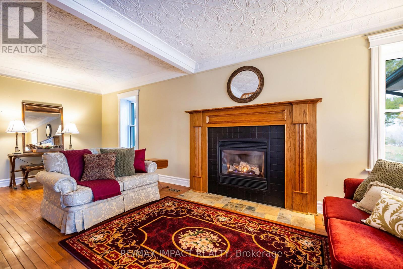 870B 6Th Line W, Trent Hills, ON - Indoor Photo Showing Living Room With Fireplace