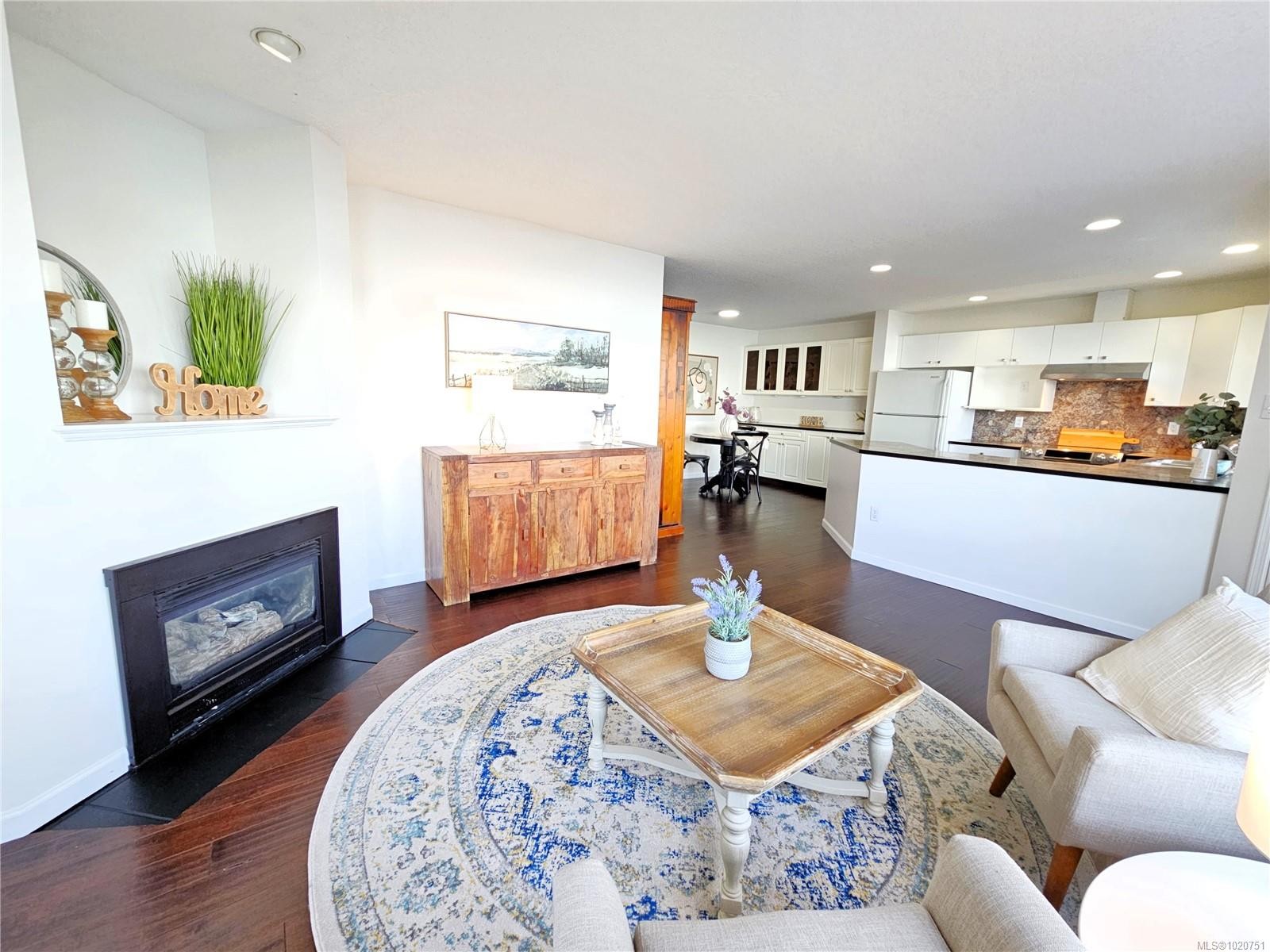 103-3156 Island Hwy West, Qualicum Beach, BC - Indoor Photo Showing Living Room With Fireplace