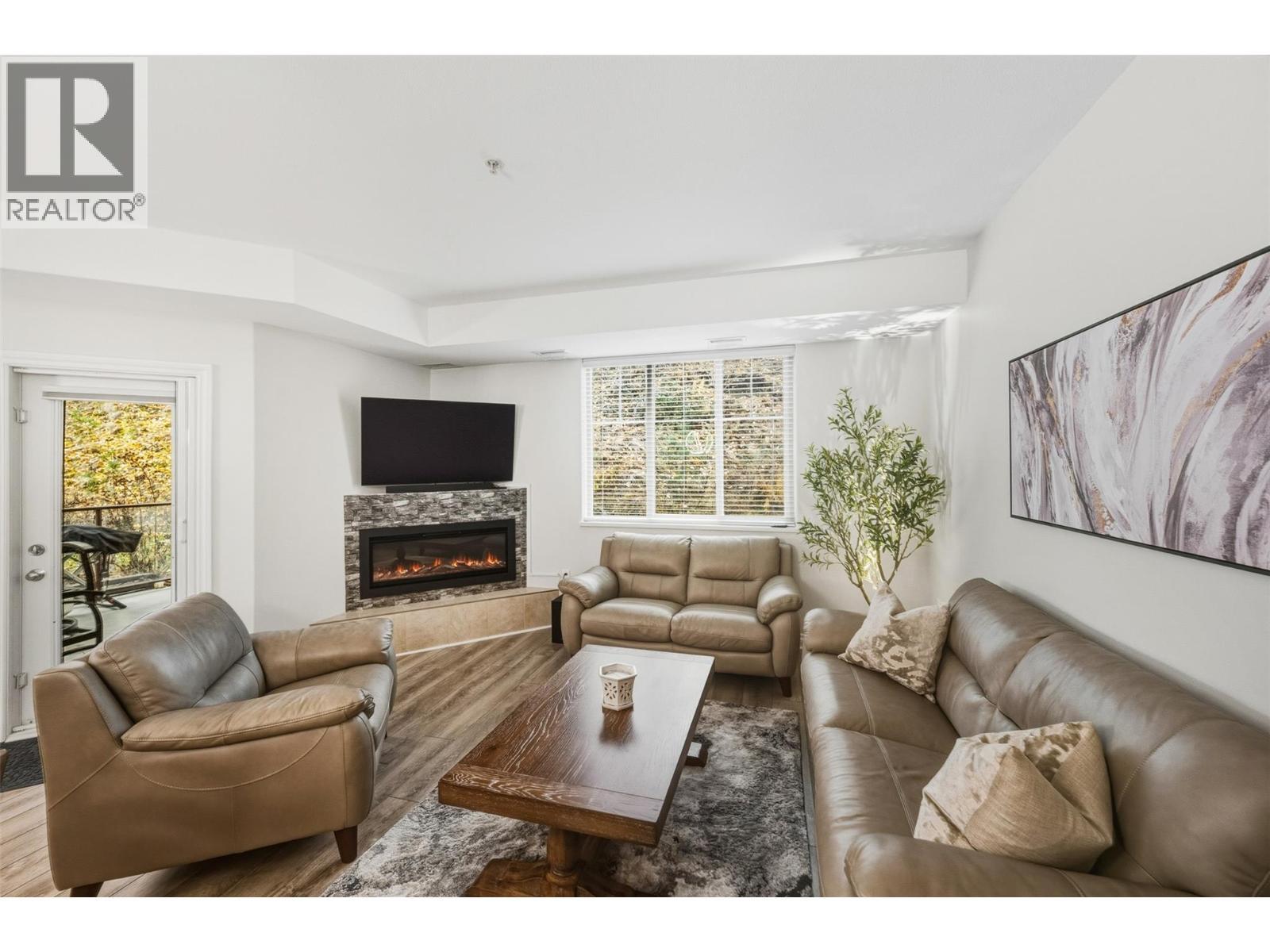 Living room - 921 Spillway Road Unit# 102B, Oliver, BC - Indoor Photo Showing Living Room With Fireplace
