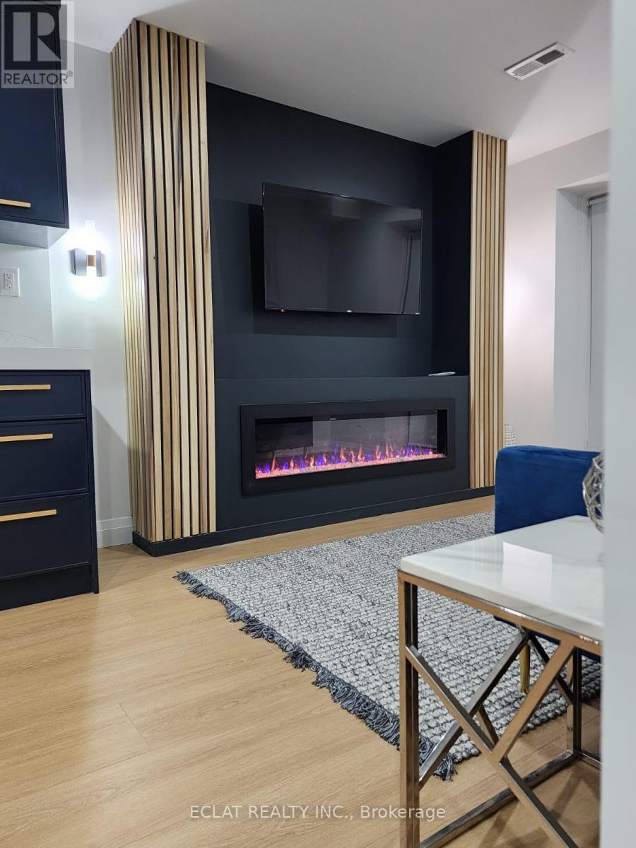 75 Vanilla Trail(Lower), Thorold, ON - Indoor Photo Showing Living Room With Fireplace