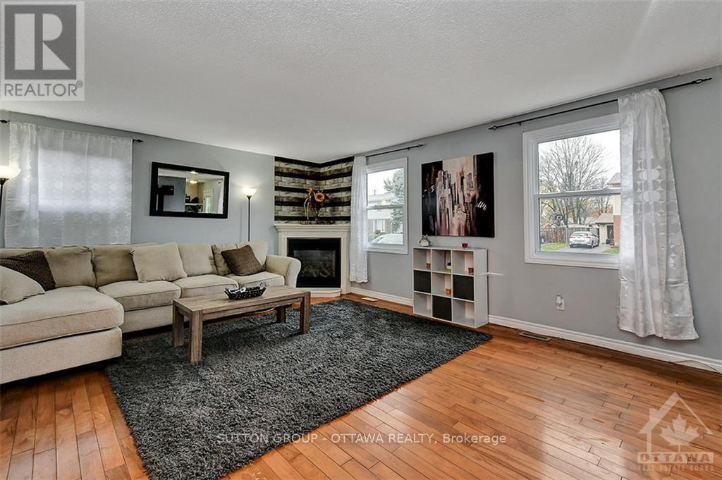 20 Dundegan Drive, Ottawa, ON - Indoor Photo Showing Living Room With Fireplace