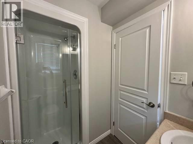 Bathroom featuring vanity and a shower stall - 750 Paris Boulevard Unit# 1, Waterloo, ON - Indoor Photo Showing Bathroom