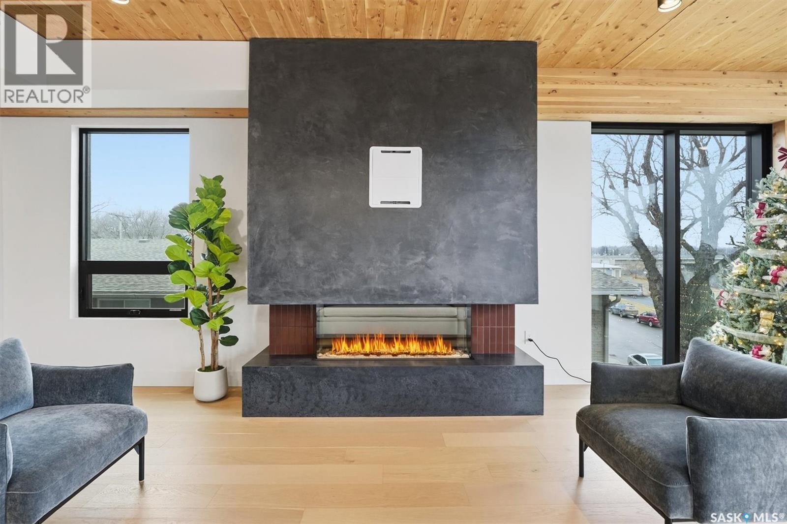 301 212 E Saskatchewan Crescent E, Saskatoon, SK - Indoor Photo Showing Other Room With Fireplace