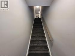 Stairs featuring baseboards -