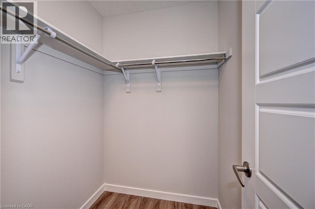 Spacious closet featuring light wood finished floors - 118 Gravel Ridge Trail Unit# C17, Kitchener, ON - Indoor With Storage