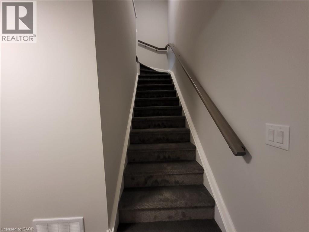 Stairs featuring baseboards - 118 Gravel Ridge Trail Unit# B23, Kitchener, ON - Indoor Photo Showing Other Room