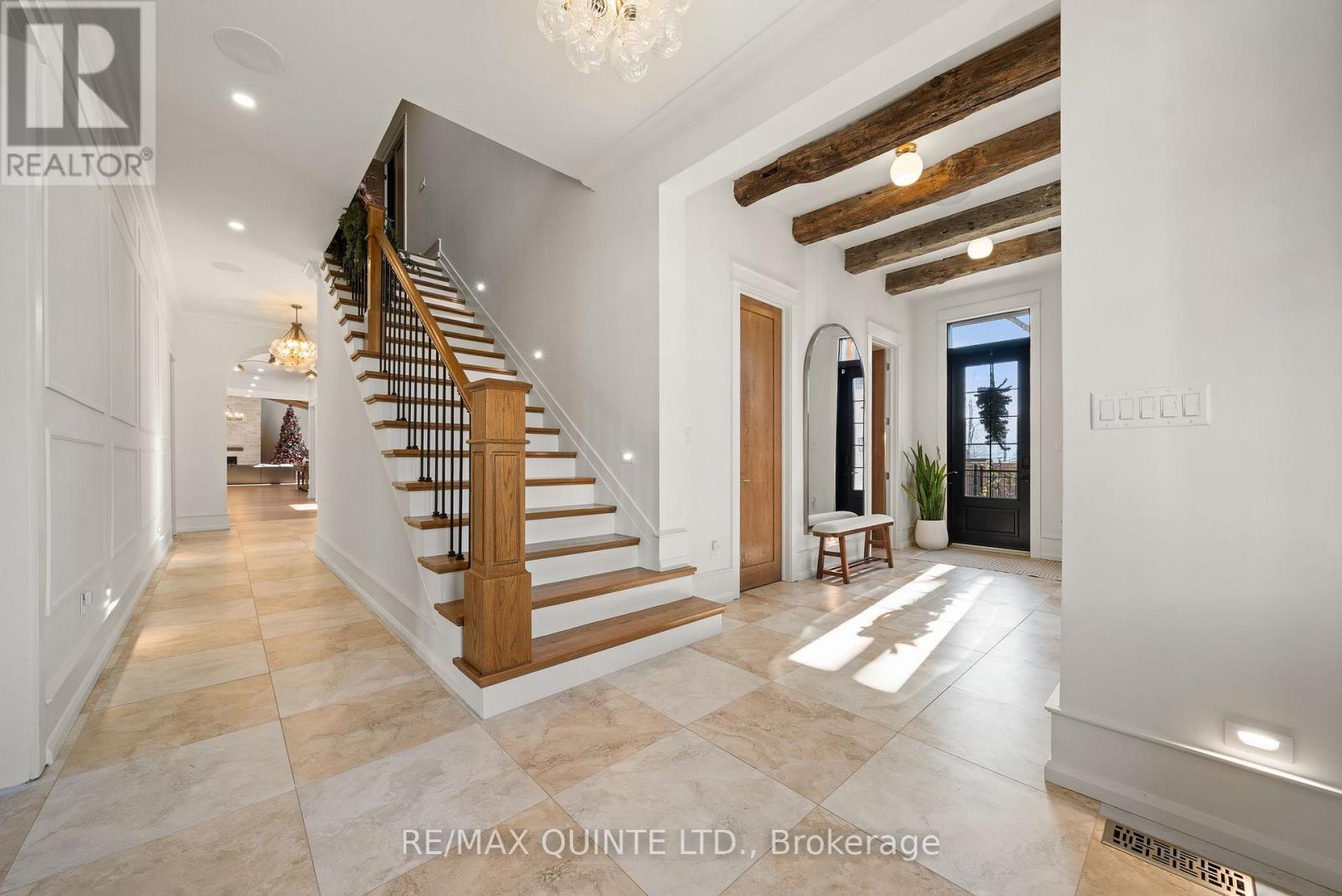 Foyer with oak stairs and WIC - 88 Bridge Street, Prince Edward County (Picton Ward), ON - Indoor Photo Showing Other Room