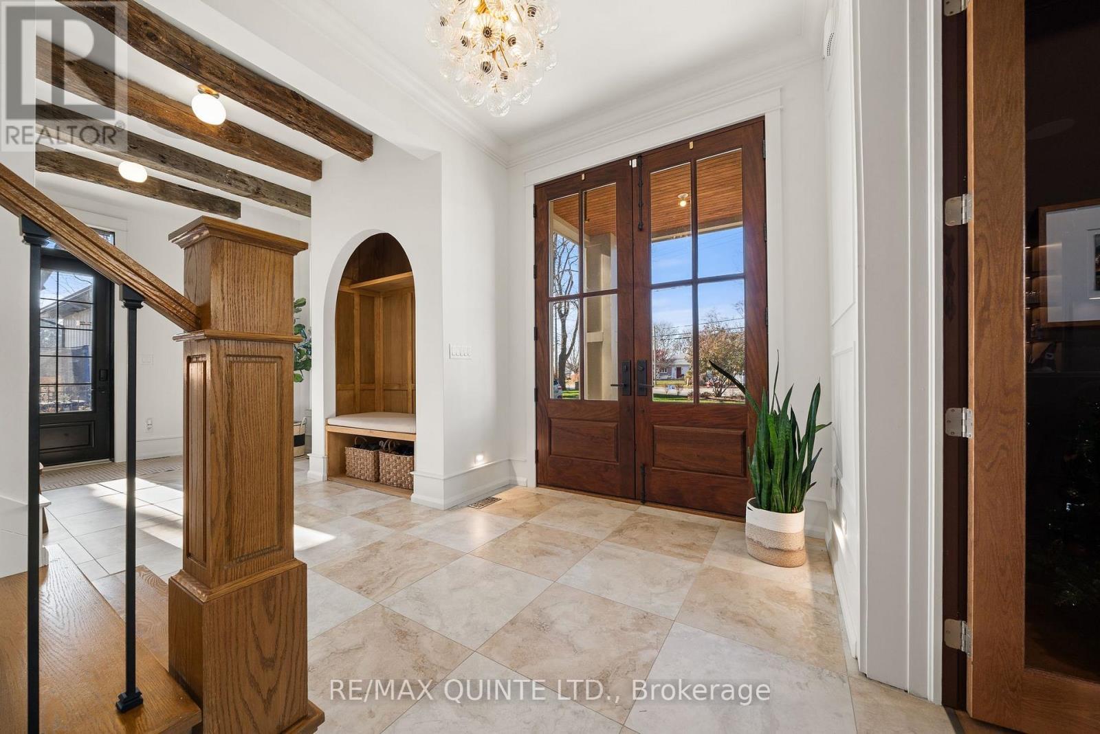 Foyer with wood front doors and built in - 88 Bridge Street, Prince Edward County (Picton Ward), ON - Indoor Photo Showing Other Room