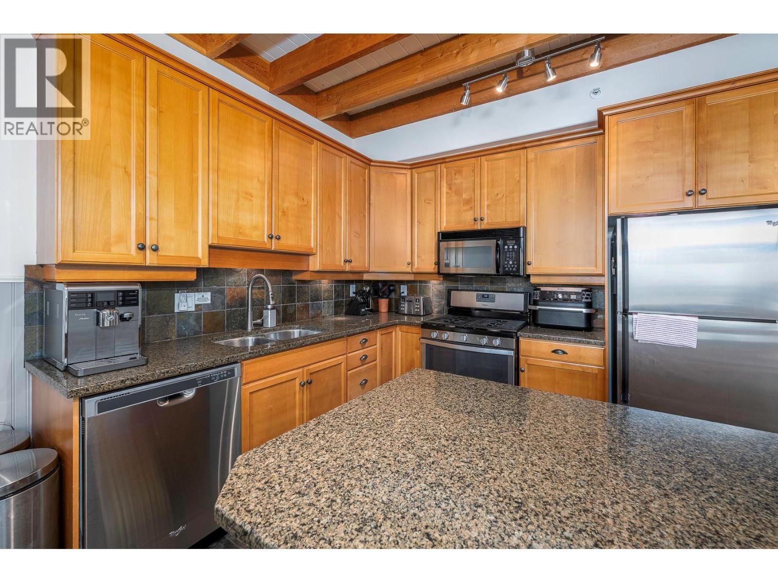 5940 Snowpines Way Unit# 2, Big White, BC - Indoor Photo Showing Kitchen With Double Sink