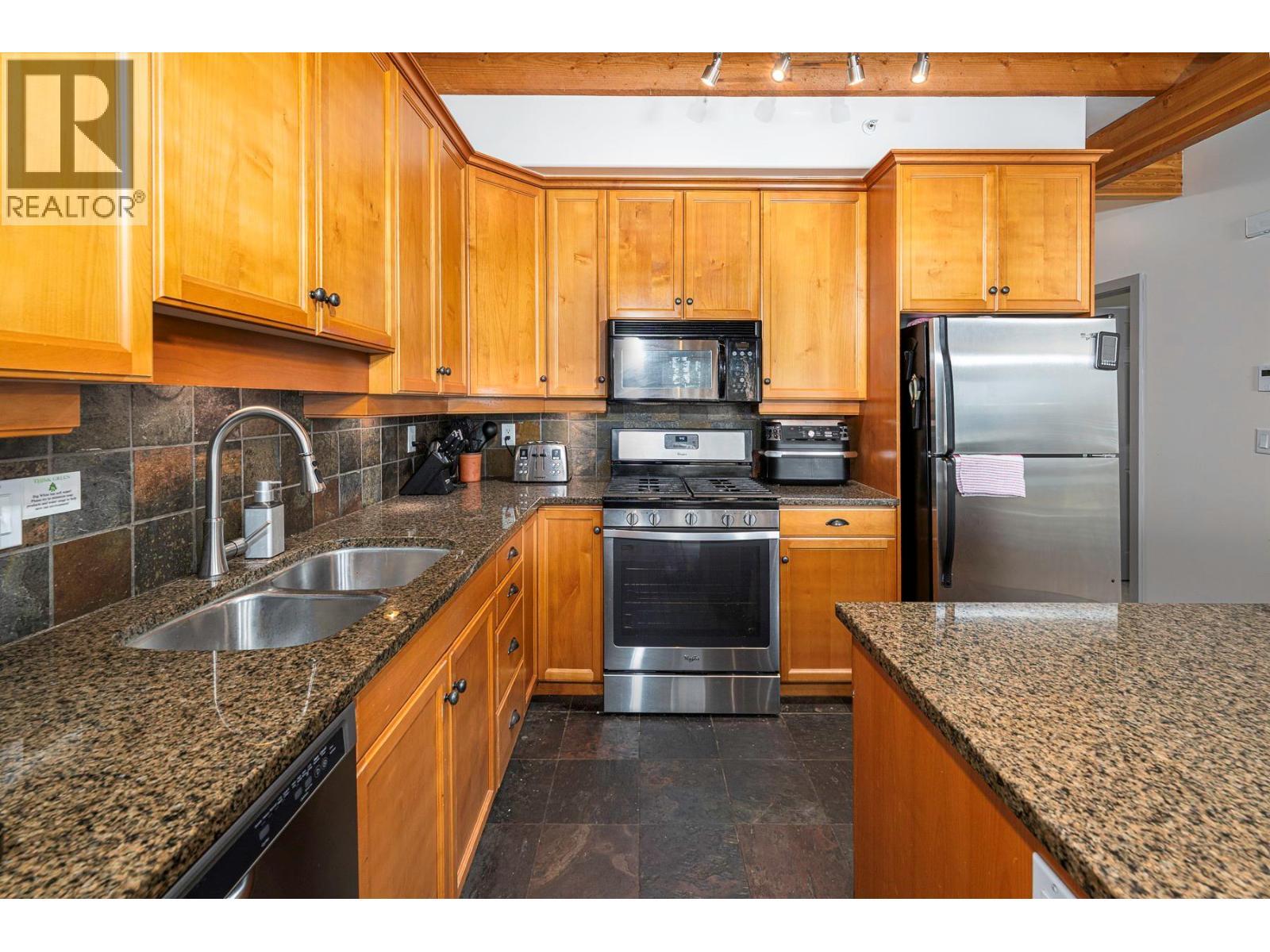 5940 Snowpines Way Unit# 2, Big White, BC - Indoor Photo Showing Kitchen With Double Sink