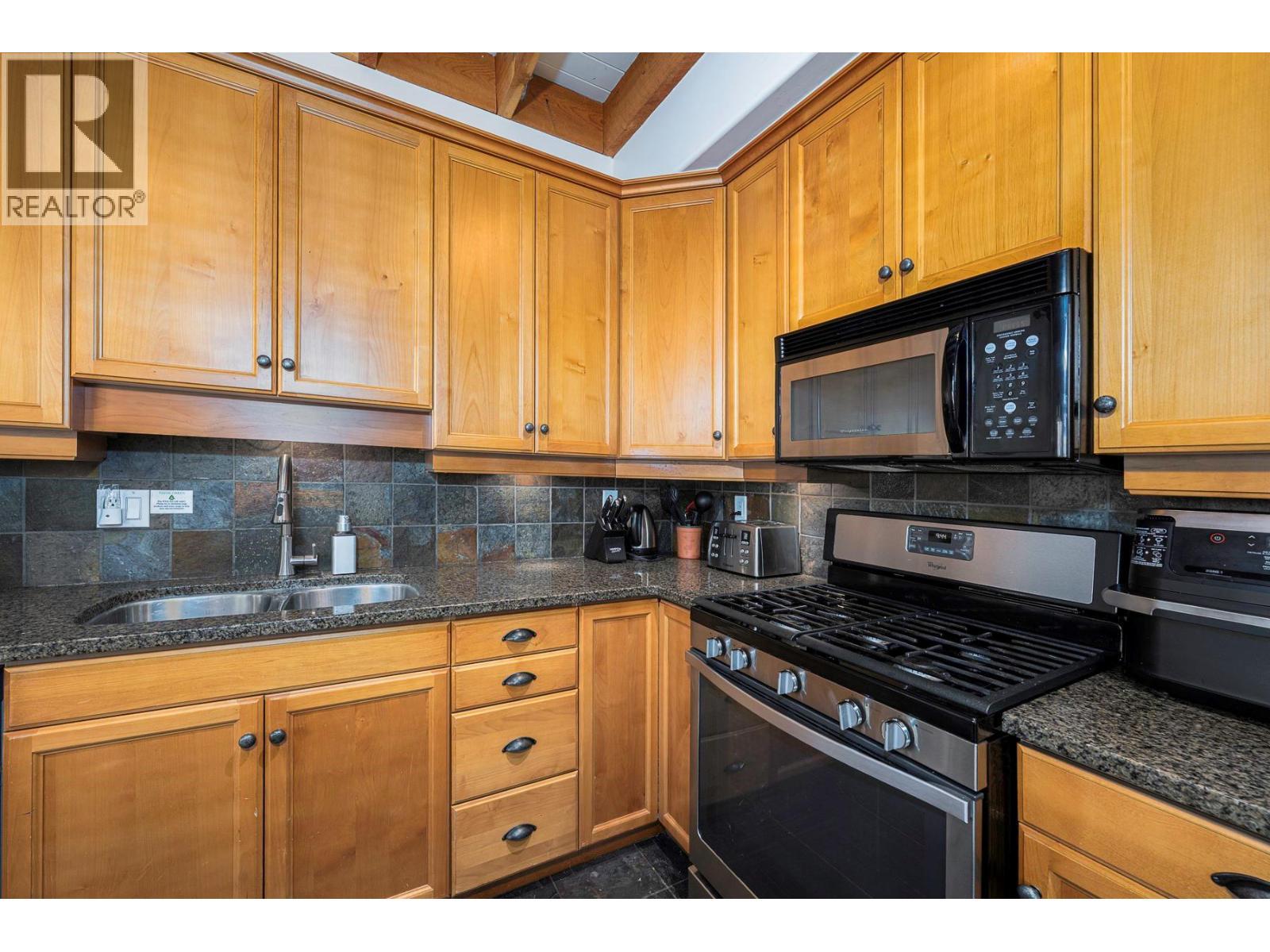 5940 Snowpines Way Unit# 2, Big White, BC - Indoor Photo Showing Kitchen With Double Sink