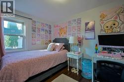 Bedroom with wood finished floors -