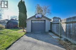 Detached garage with asphalt driveway -
