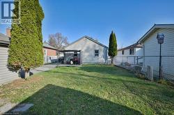 Fenced backyard with a patio area -