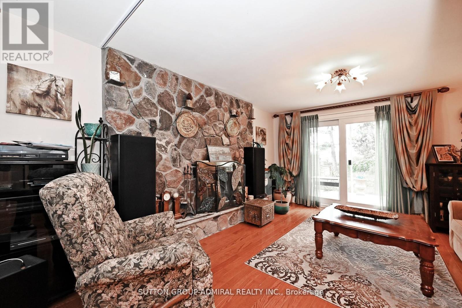 47 Tobermory Drive, Toronto, ON - Indoor Photo Showing Living Room With Fireplace