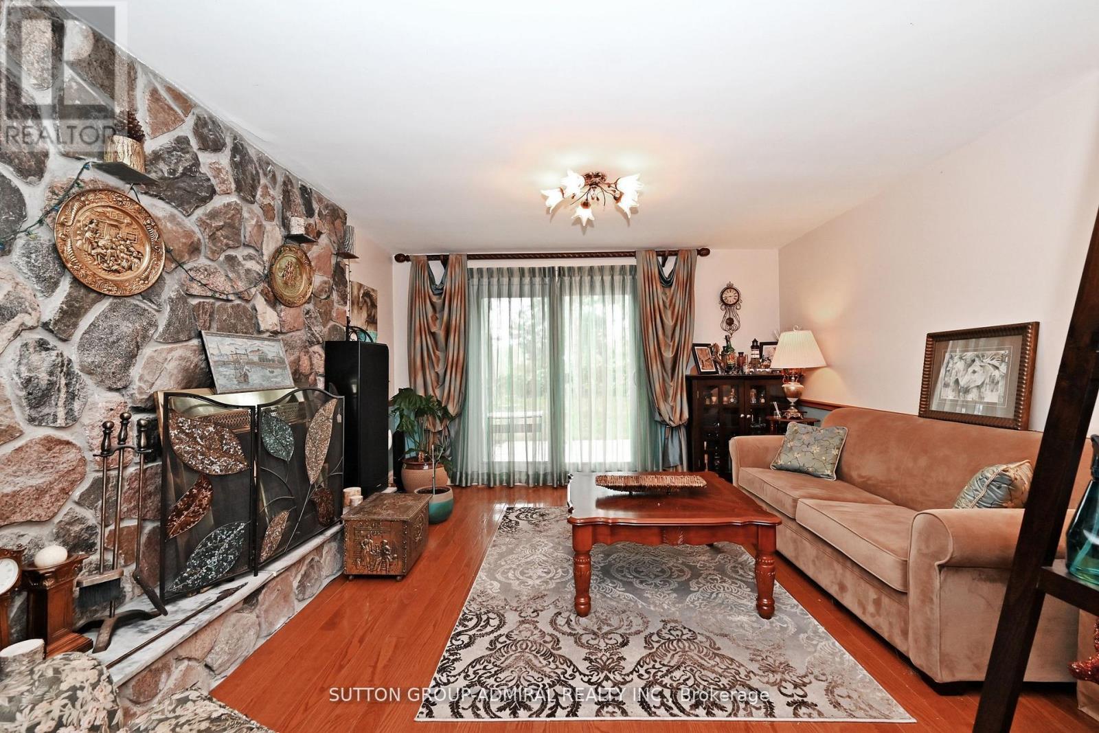 47 Tobermory Drive, Toronto, ON - Indoor Photo Showing Living Room With Fireplace