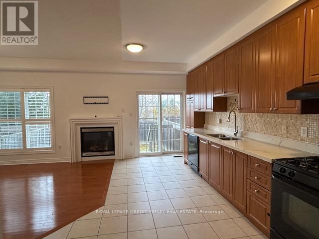 4 Blue Meadow Court, Markham, ON - Indoor Photo Showing Kitchen With Fireplace
