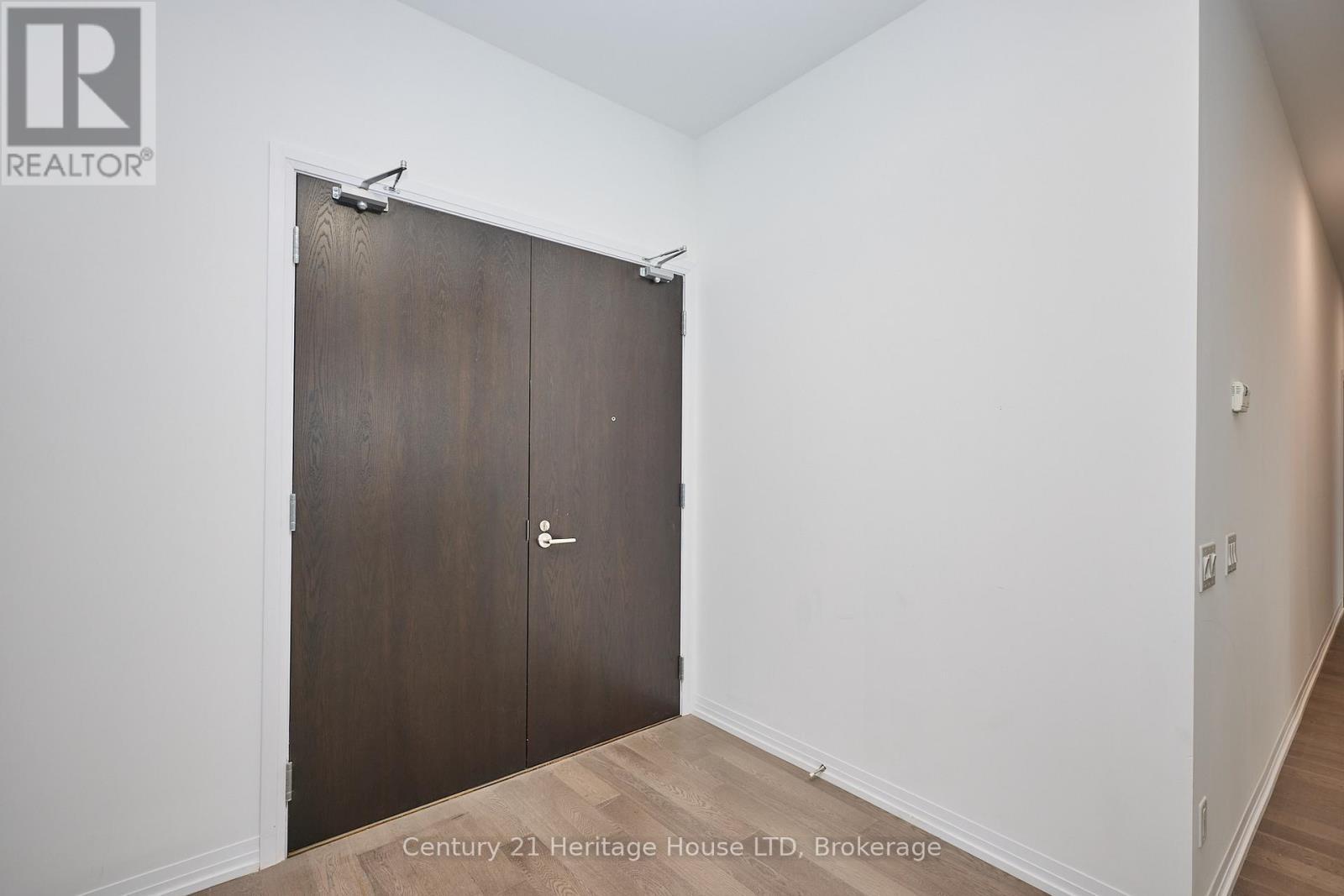 double door condo entry - 1001 - 7711 Green Vista Gate, Niagara Falls (Oldfield), ON - Indoor Photo Showing Other Room