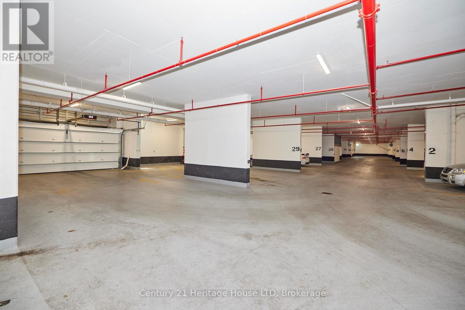2 spot underground parking with auto-door - 1001 - 7711 Green Vista Gate, Niagara Falls (Oldfield), ON - Indoor Photo Showing Garage
