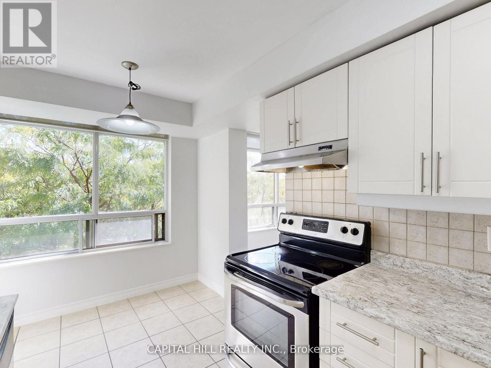 312 - 710 Humberwood Boulevard, Toronto, ON - Indoor Photo Showing Kitchen