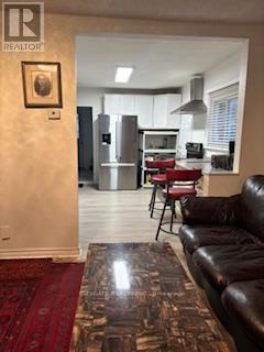 7801 Woodbine Street, Niagara Falls, ON - Indoor Photo Showing Living Room With Fireplace