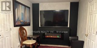7801 Woodbine Street, Niagara Falls, ON - Indoor With Fireplace