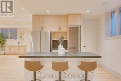 Wet bar with beverage and full size fridge -