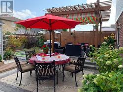 Custom Backyard with two interlock patios -