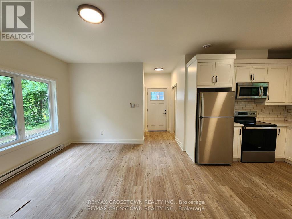 Bright open airy open concept living area - Gdn Ste - 120 Dundonald Street, Barrie, ON - Indoor Photo Showing Kitchen
