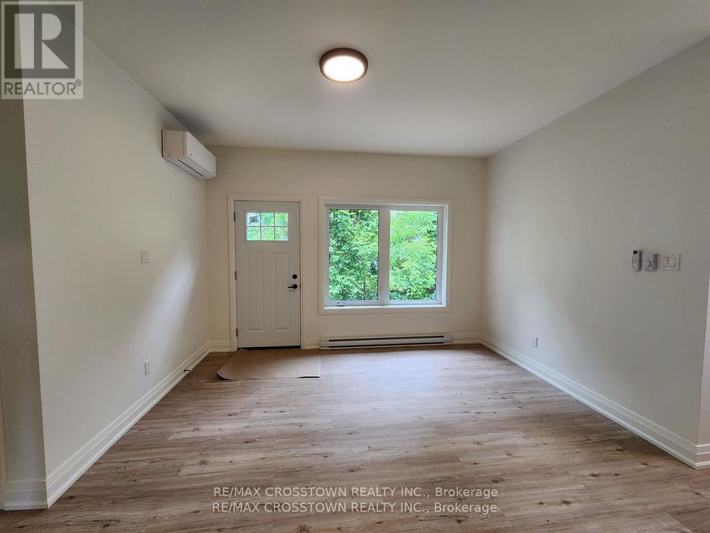 Living area with walkout to backyard area - Gdn Ste - 120 Dundonald Street, Barrie, ON - Indoor Photo Showing Other Room