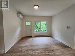 Living area with walkout to backyard area -