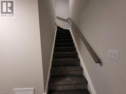 Stairs featuring baseboards -