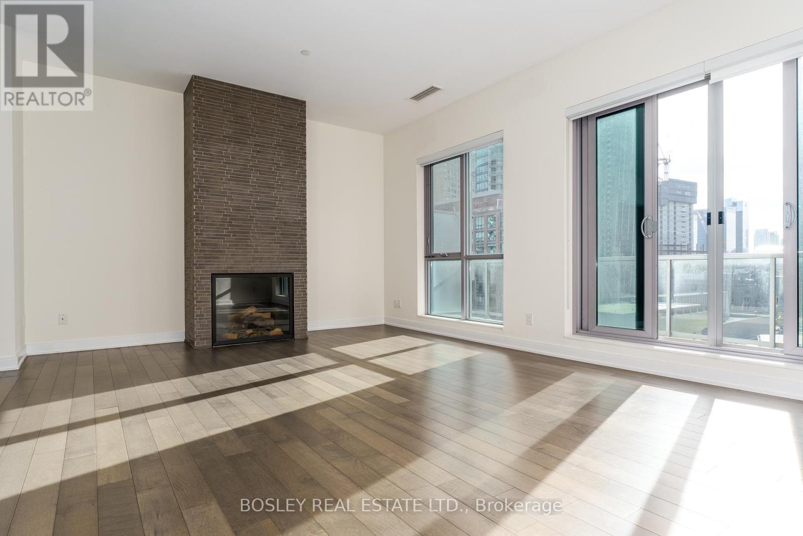 Ph1203 - 55 Front Street E, Toronto, ON - Indoor Photo Showing Living Room With Fireplace
