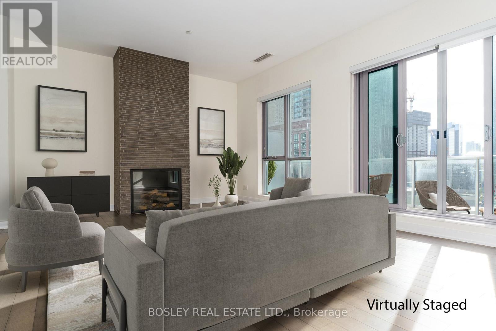 Ph1203 - 55 Front Street E, Toronto, ON - Indoor Photo Showing Living Room With Fireplace