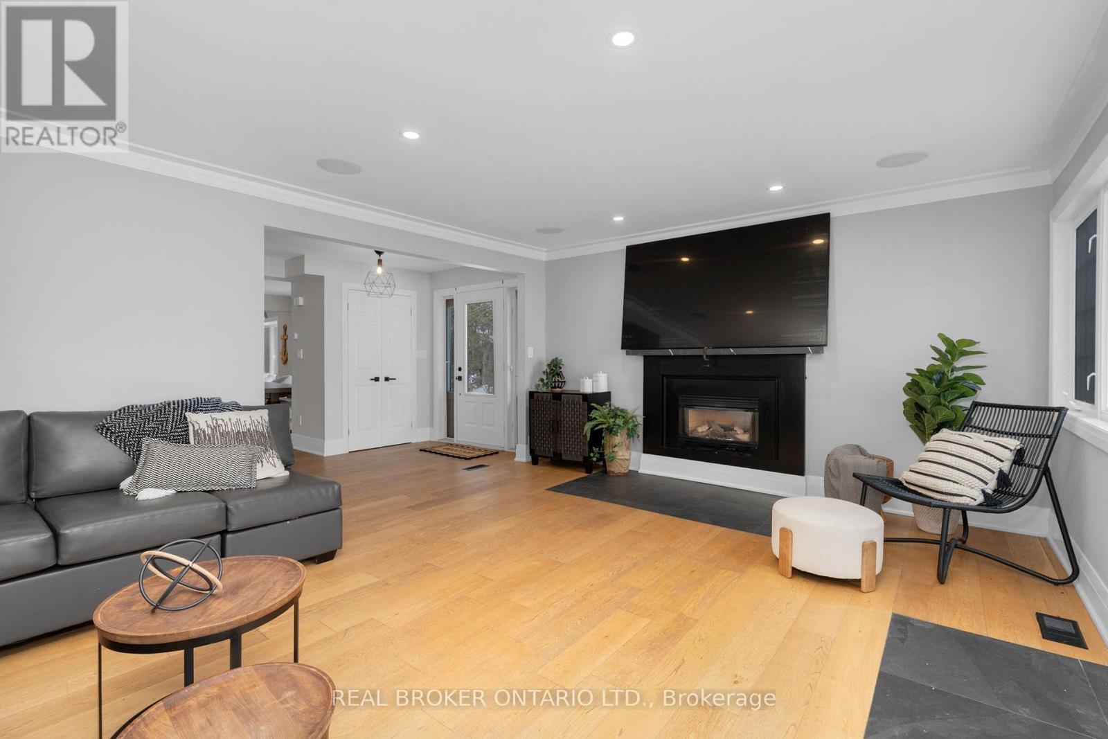 943 Barry Avenue, Innisfil, ON - Indoor Photo Showing Living Room With Fireplace