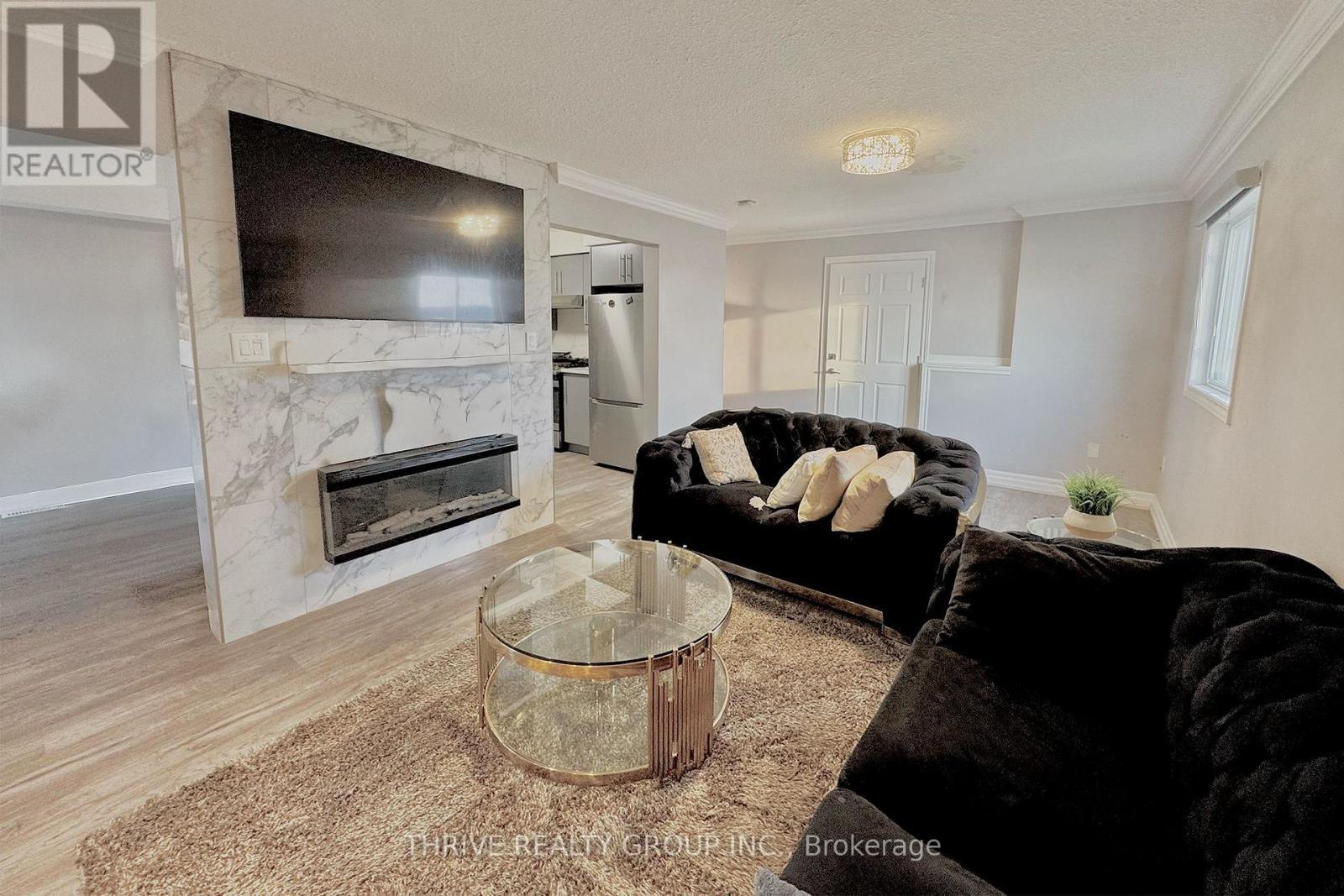 Upper - 1608 Evans Boulevard, London South (South U), ON - Indoor Photo Showing Living Room With Fireplace