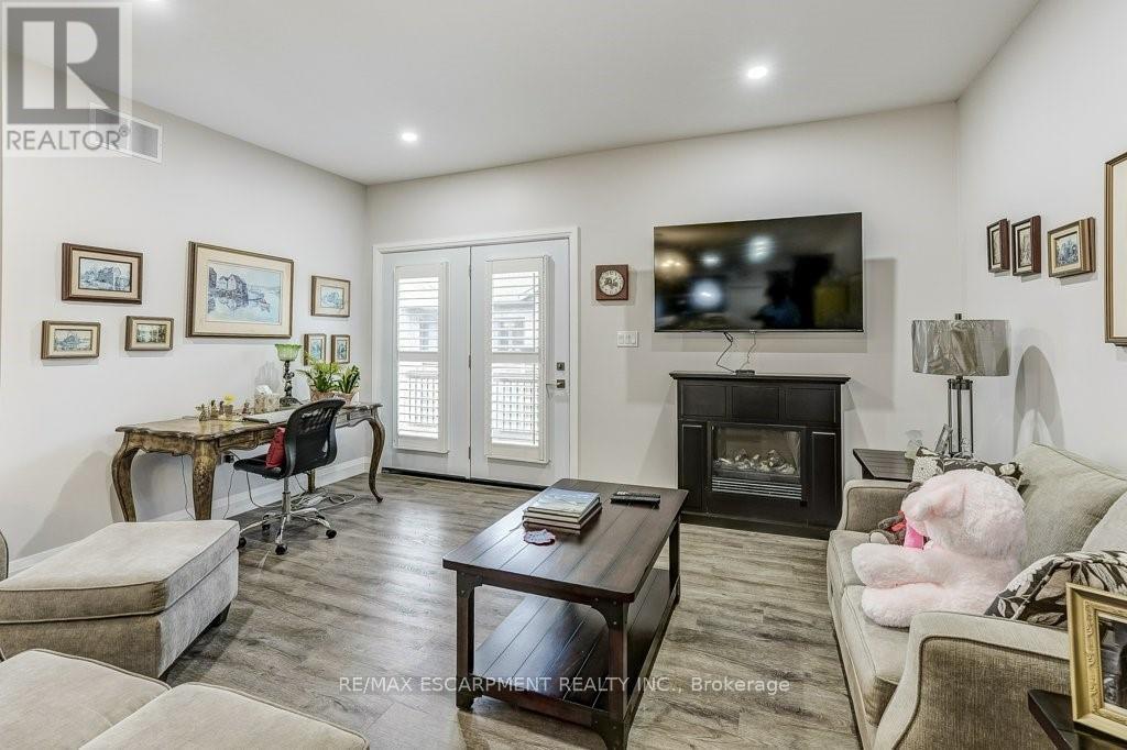 273 Queen Street W, North Perth, ON - Indoor Photo Showing Living Room With Fireplace