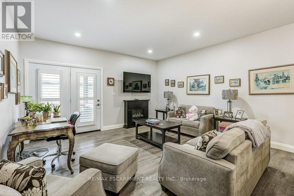 273 Queen Street W, North Perth, ON - Indoor Photo Showing Living Room With Fireplace