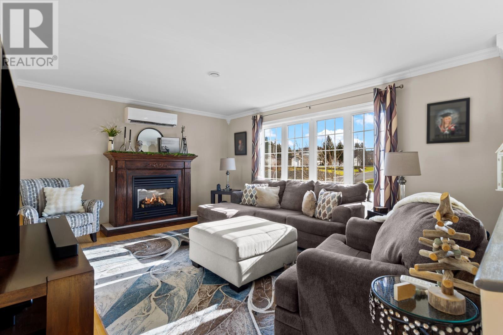 18 Shaheen Crescent, Come By Chance, NL - Indoor Photo Showing Living Room With Fireplace