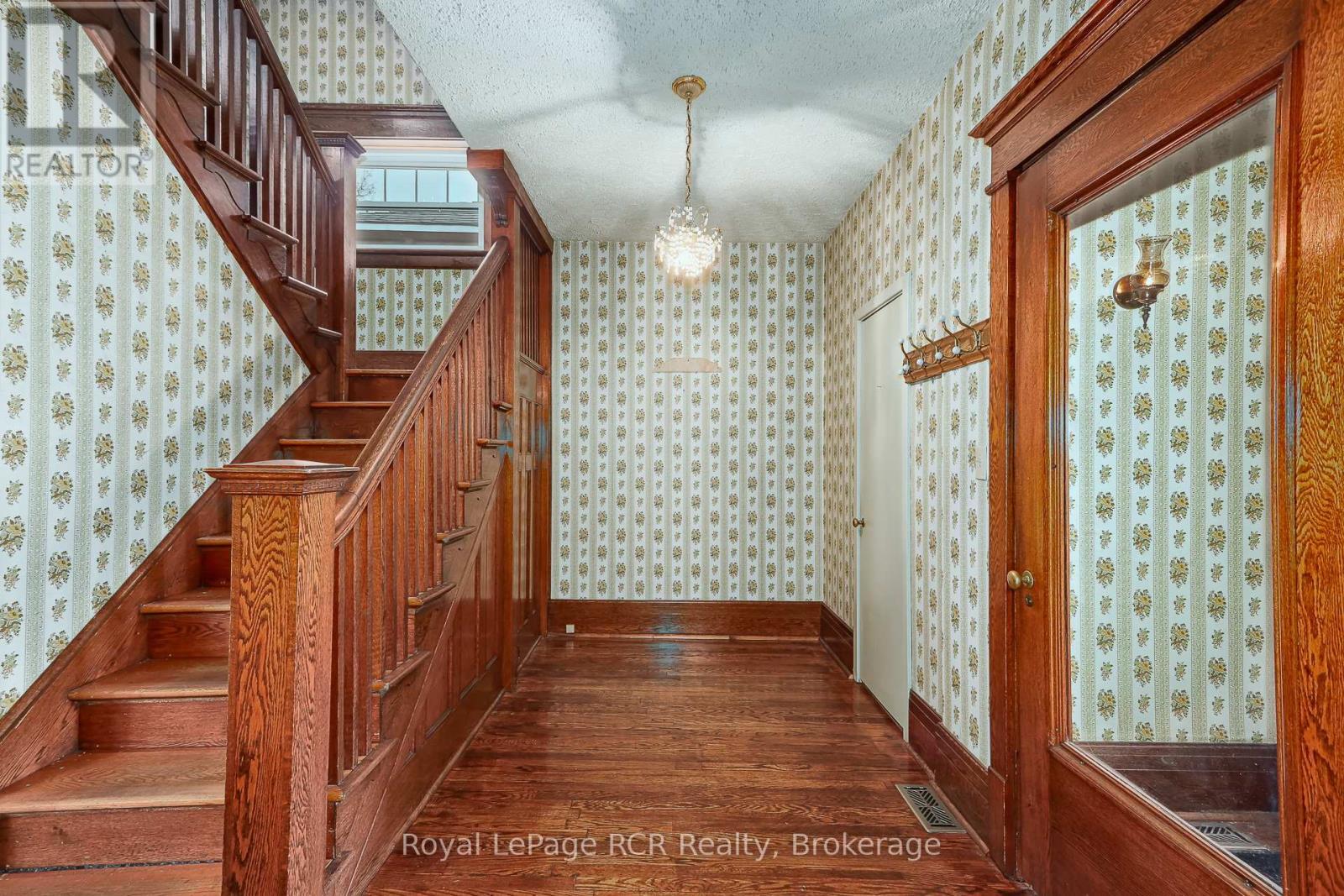Elegant original woodwork in foyer - 143 Trowbridge Street W, Meaford, ON - Indoor Photo Showing Other Room
