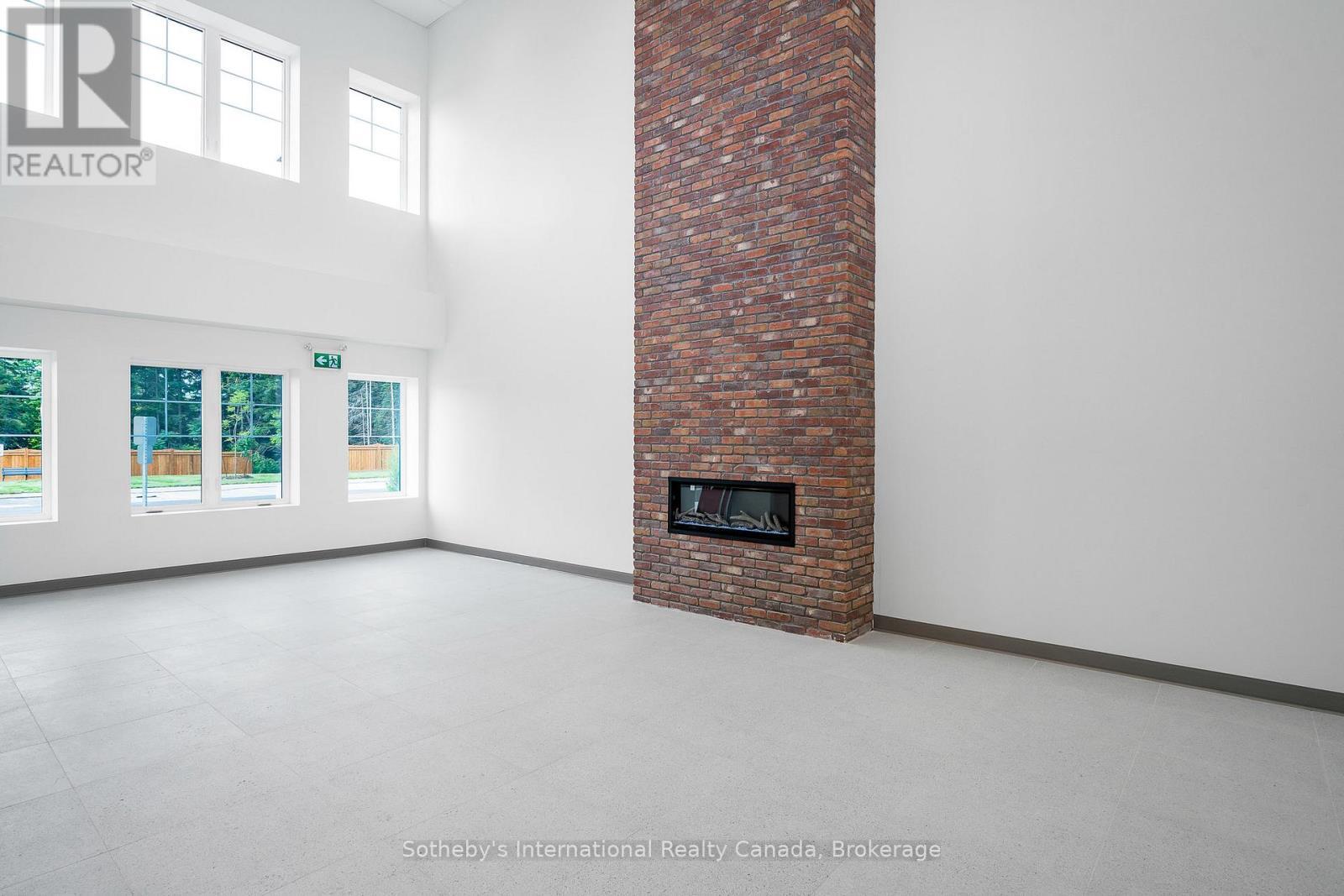 322 - 121 Mary Street, Clearview (Creemore), ON - Indoor Photo Showing Other Room With Fireplace