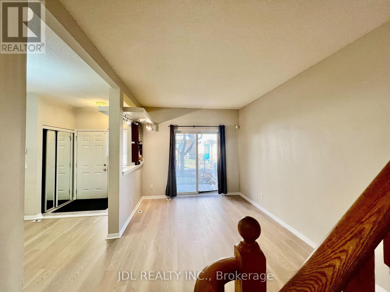 Spacious Entrance with Double Mirror Door - 26 - 10 Cox Boulevard, Markham, ON - Indoor Photo Showing Other Room