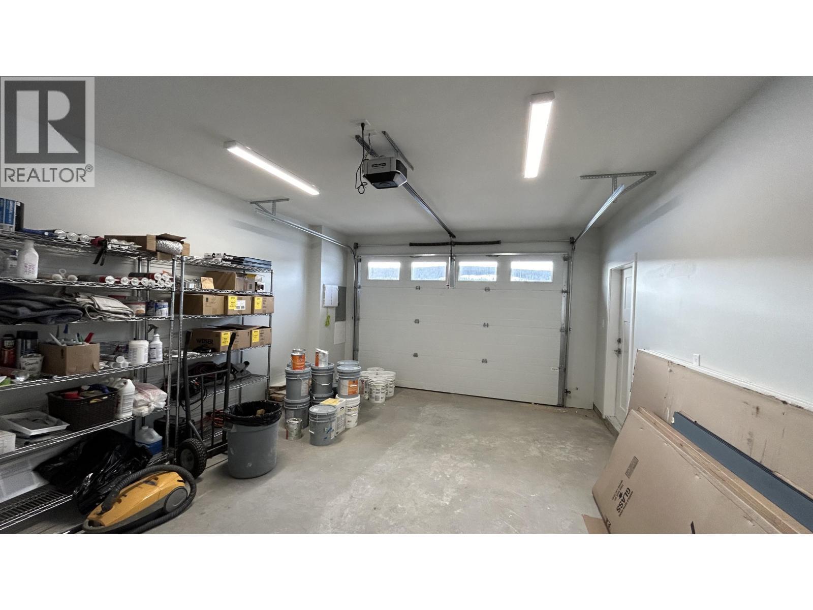 14 105 Forest Ridge Road, 100 Mile House, BC - Indoor Photo Showing Garage