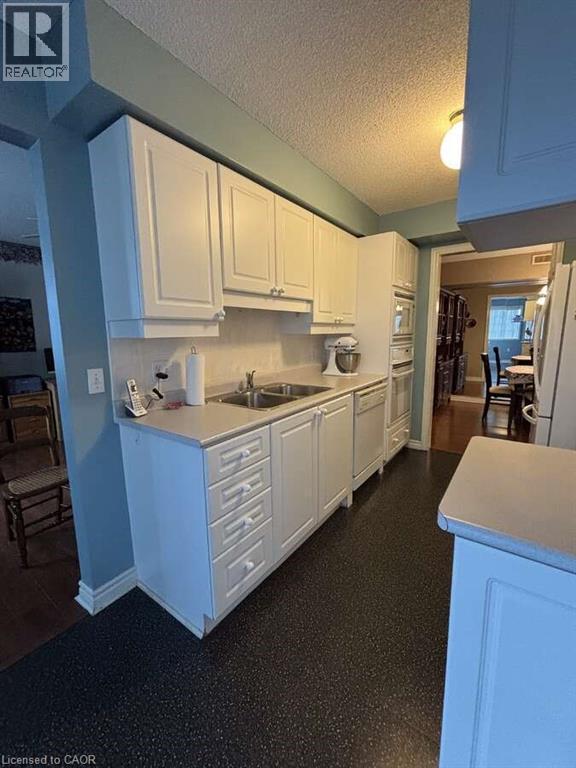 600 Silverbirch Boulevard Unit# 308, Mount Hope, ON - Indoor Photo Showing Kitchen With Double Sink