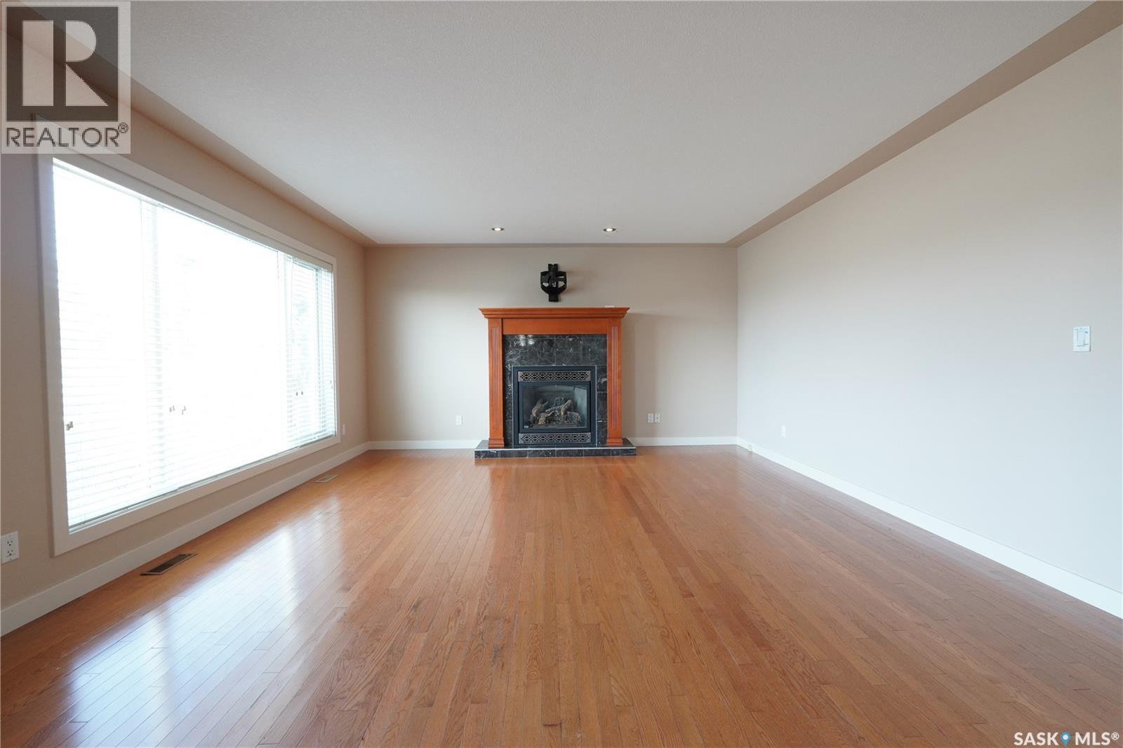 15 Christopher Place, White City, SK - Indoor Photo Showing Living Room With Fireplace
